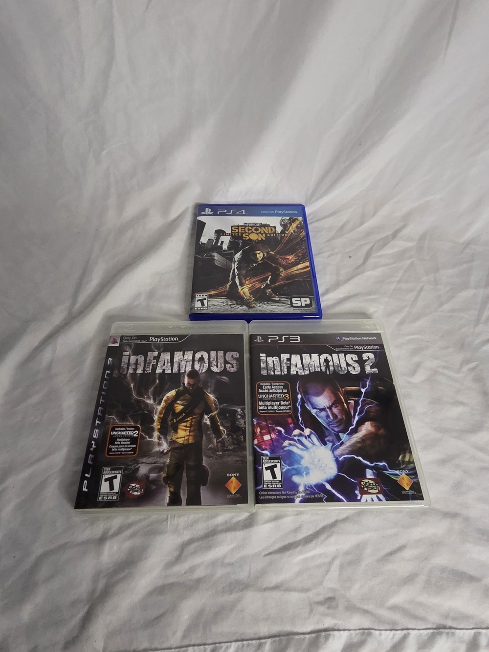Sony Infamous Trilogy Game Set - Black & Blue Cases